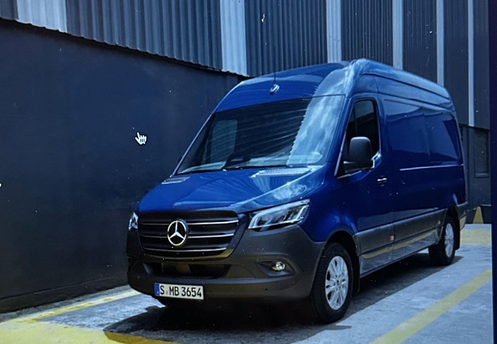 Blue Mercedes-Benz Sprinter-style courier van